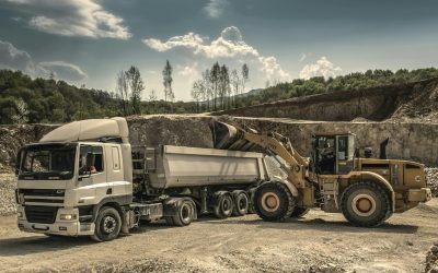 pexels-photo-188679-188679 Excavator and truck working together in a quarry, showcasing industrial equipment and operations.